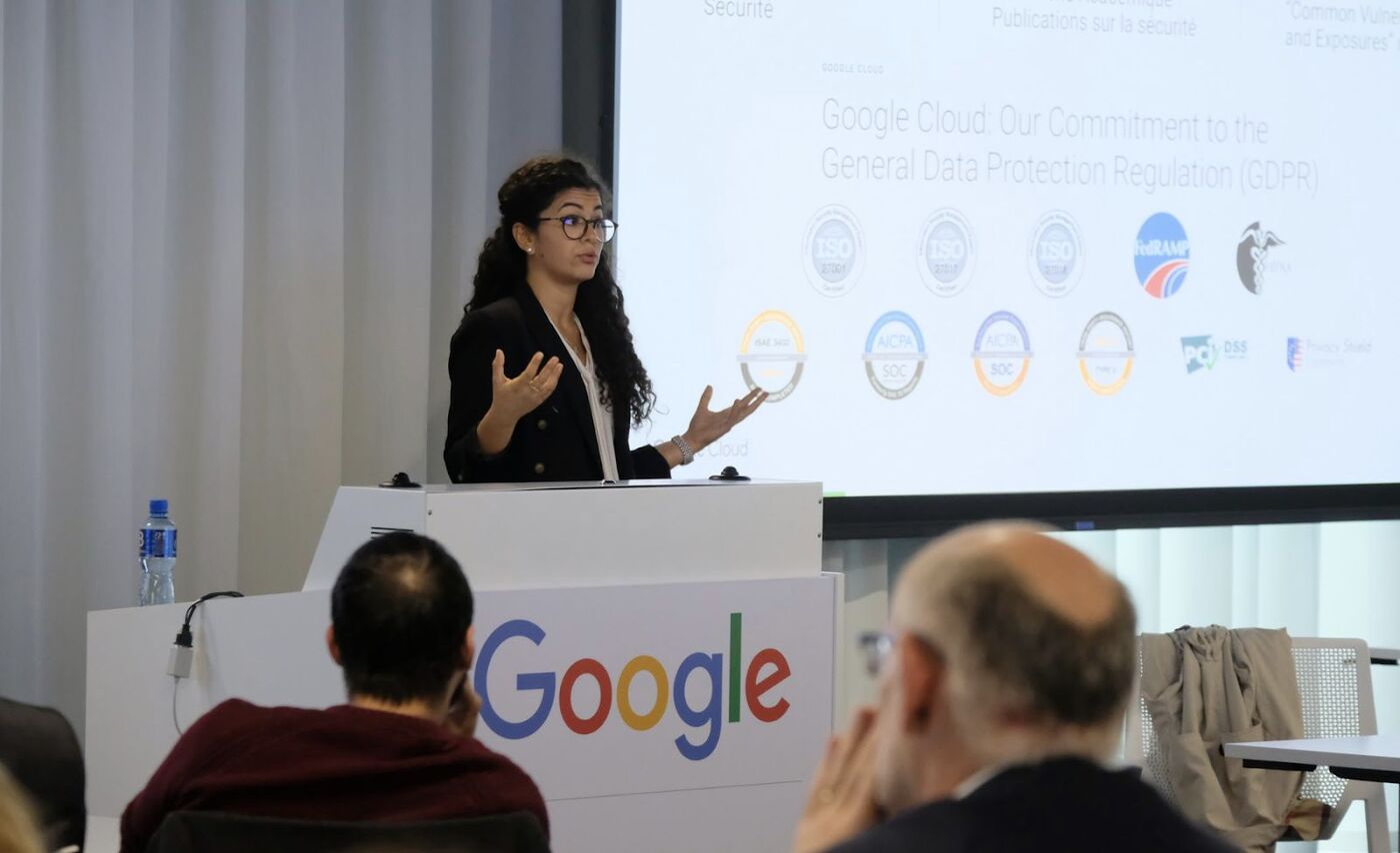 Rita speaking at a lectern during a conference in Dublin